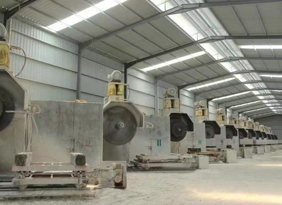 Stone processing workshop with CNC machinery at Phoenix Power Stone